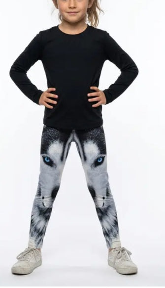 Girl wearing blue-eyed wolf print girls leggings