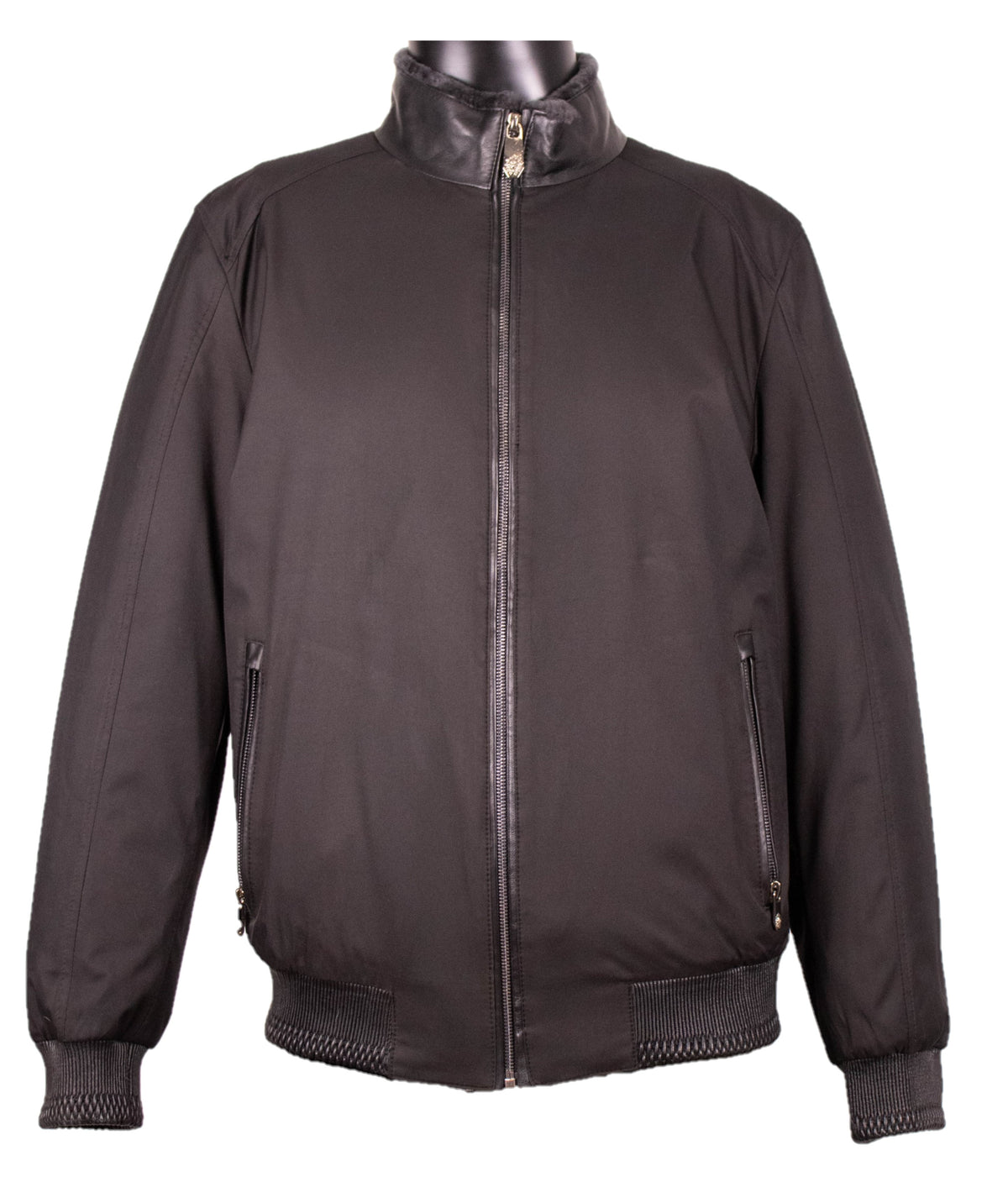 Front view of the black nylon jacket with shearling, stand collar, full zip front, and ribbed cuffs.
