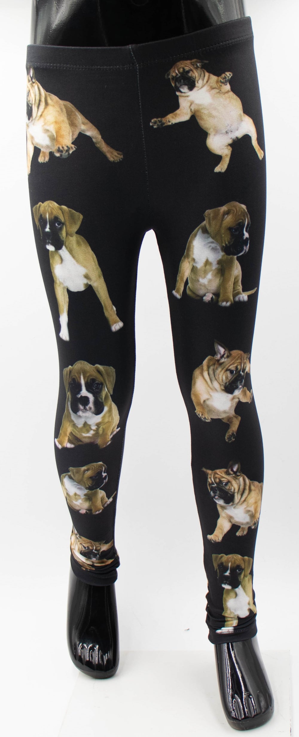 Denimaxx kids Boxer print leggings with playful tan Boxer puppy photos on black fabric, shown on a mannequin.
