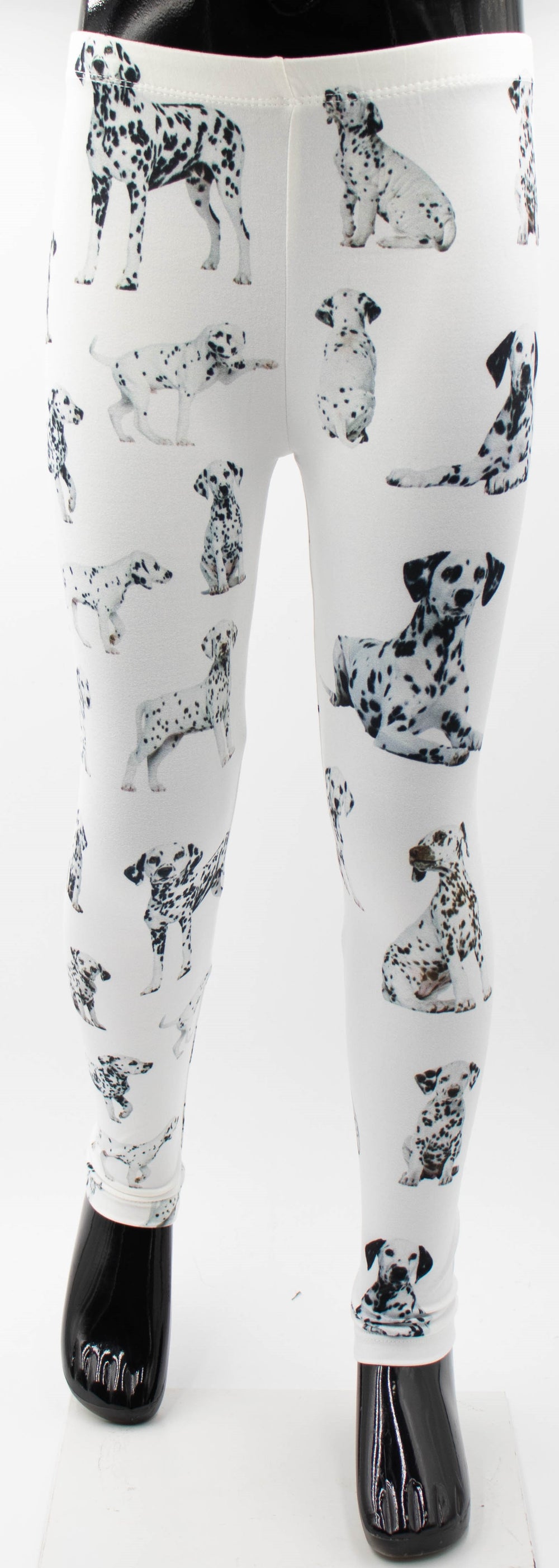 Denimaxx kids Dalmatian print leggings with spotted Dalmatian dog photos on white fabric, shown on a mannequin.