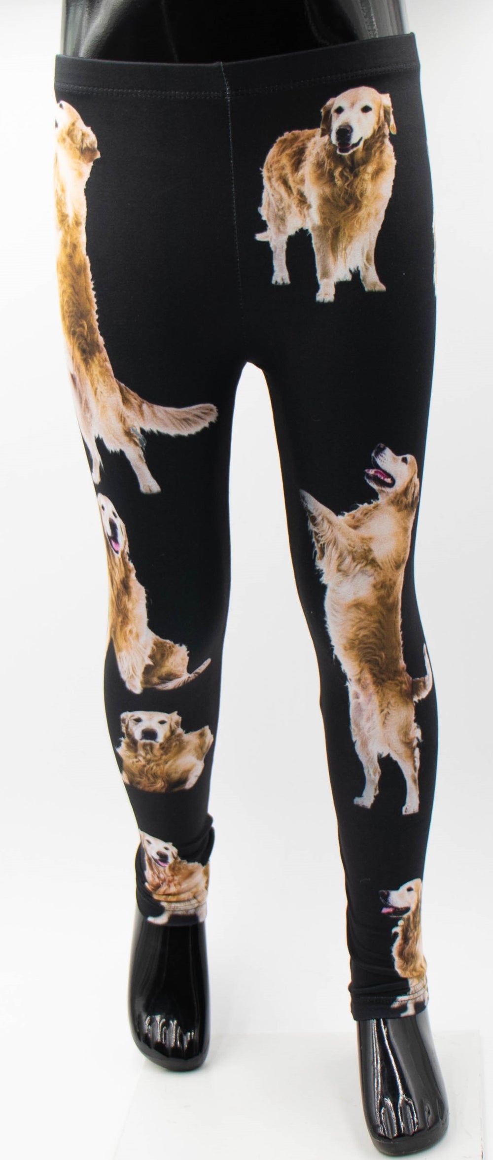 Denimaxx kids Golden Retriever print leggings with golden retriever dog photos on black fabric, shown on a mannequin.