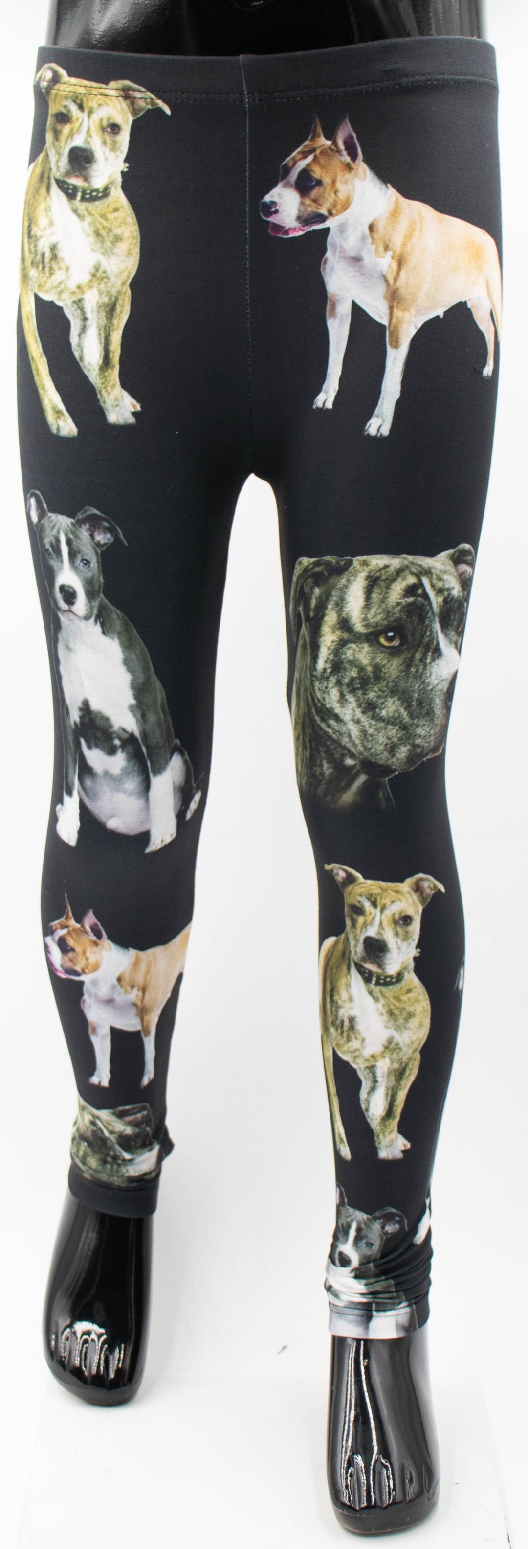 Denimaxx kids Pit Bull print leggings with brindle, tan, and gray pit bull portraits on black fabric, full-length mannequin studio shot.