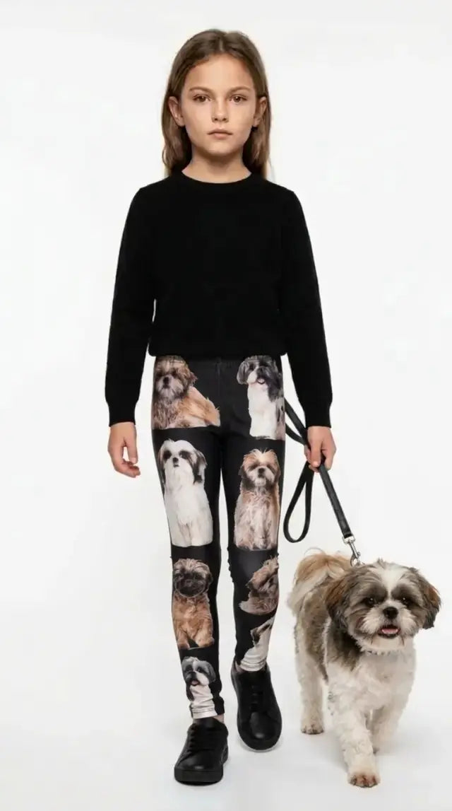Girl wearing black Shih Tzu print kids leggings with a Shih Tzu dog