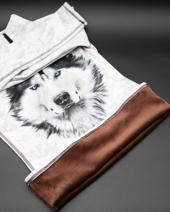 Close-up of Denimaxx Blue Eyed Wolf Mid Layer showing vivid blue eyes and polished nylon surface.

