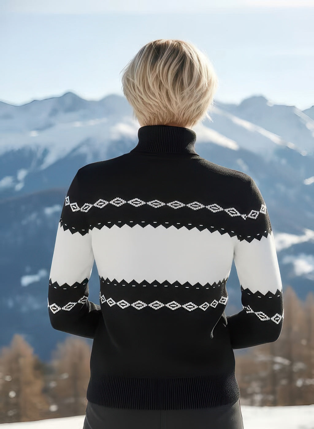 Back view of Denimaxx Women’s black and white après ski sweater showing smooth intarsia design and ribbed hem