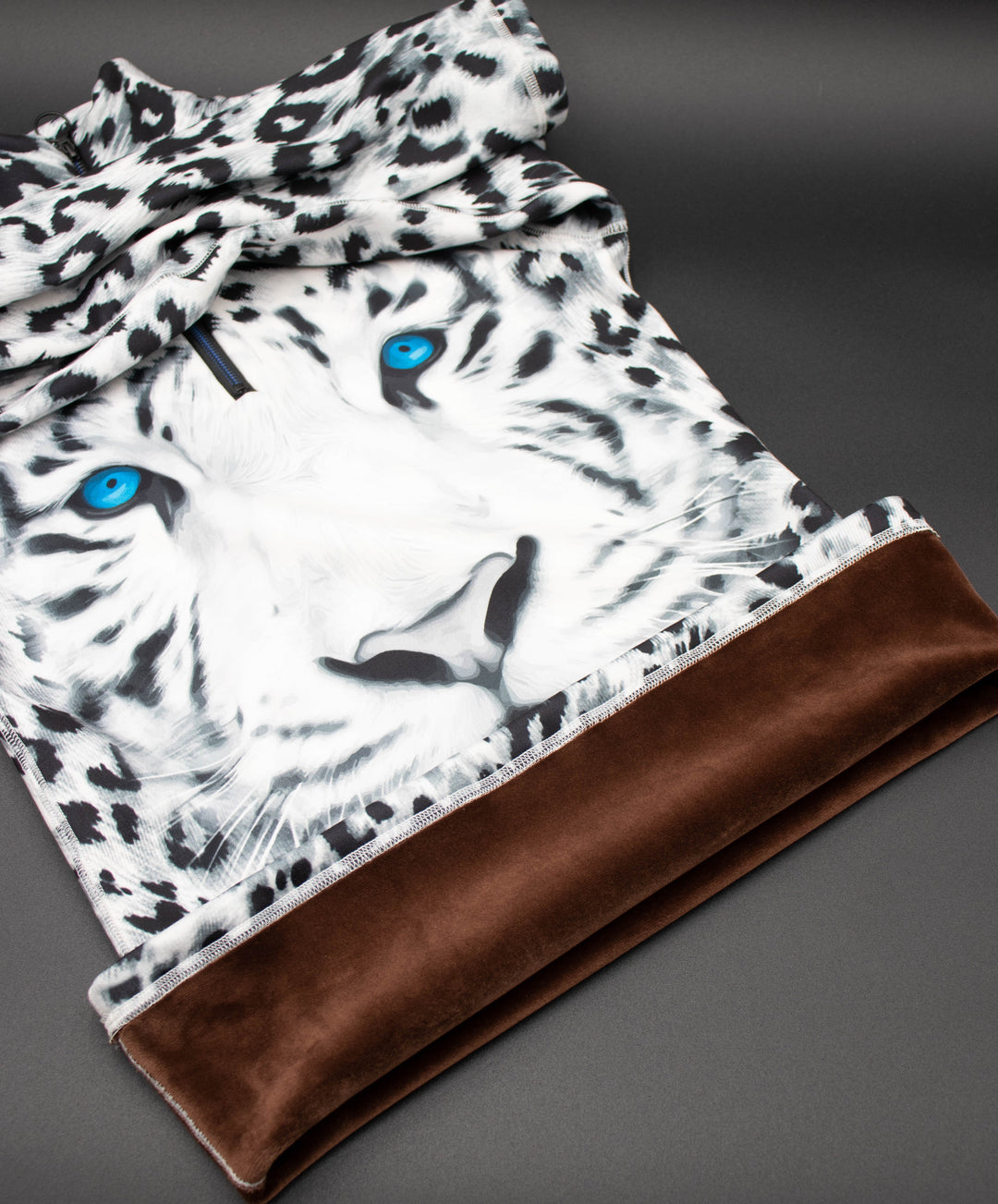 Close-up of Denimaxx Blue Eyed Tiger design featuring vivid blue eyes and detailed tiger print.



