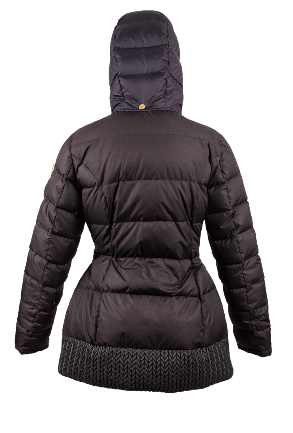 Back view of the black satin goose down puffer jacket with raised hood and chevron knit hem on white.