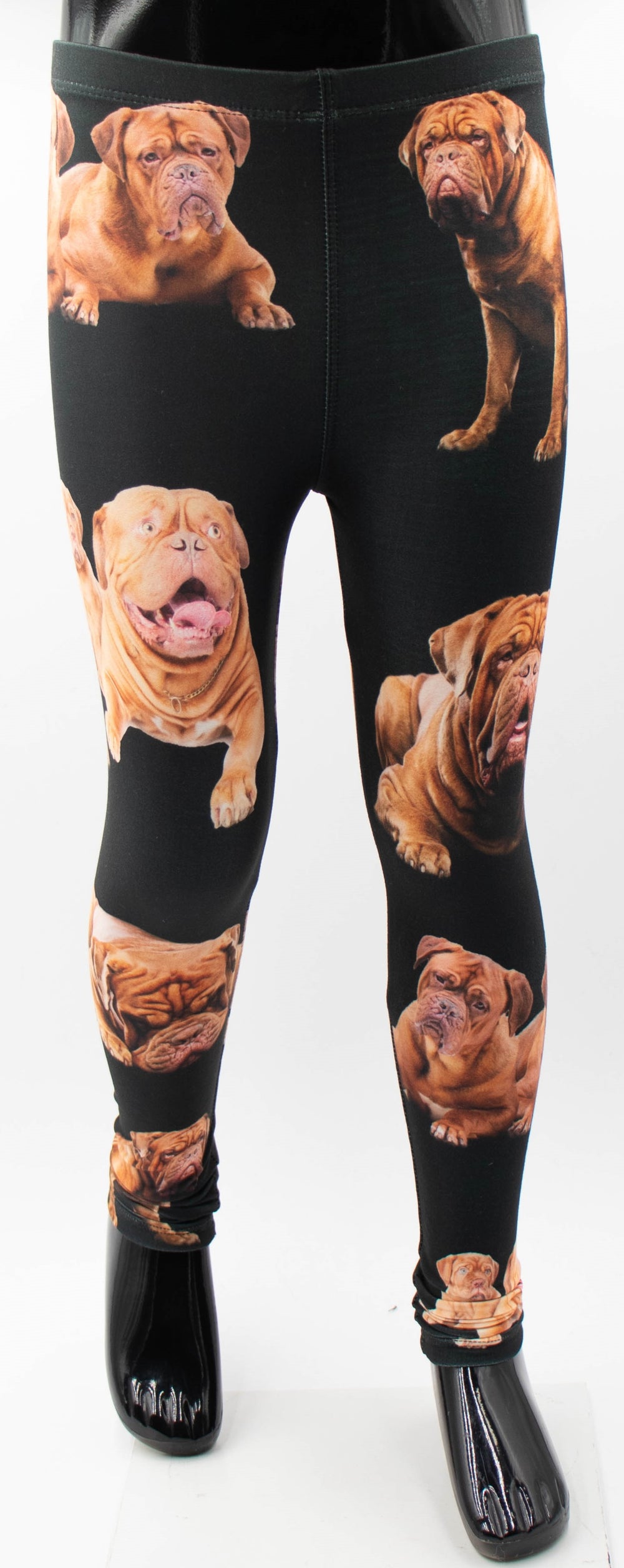 Front view of Denimaxx kids Dogue de Bordeaux print leggings with brown mastiff puppy photos on black fabric, shown on a mannequin.