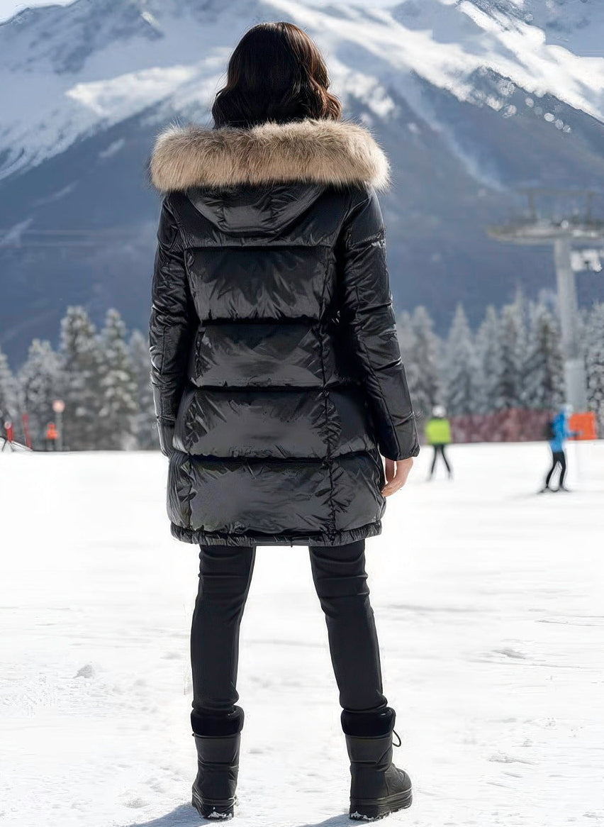 Italian satin puffer with plush raccoon fur hood and tailored silhouette by Denimaxx.

