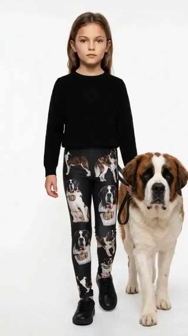 Girl wearing black Saint Bernard print kids leggings with a Saint Bernard dog