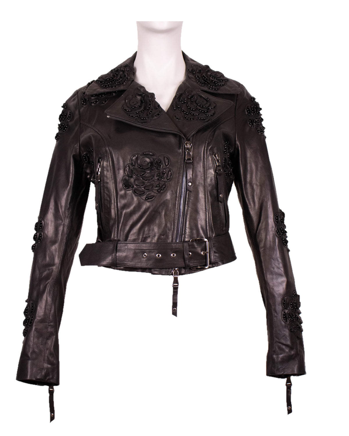 Black leather moto jacket with black rose embroidery and beaded accents on the chest and shoulders, belted waist, front view on white.