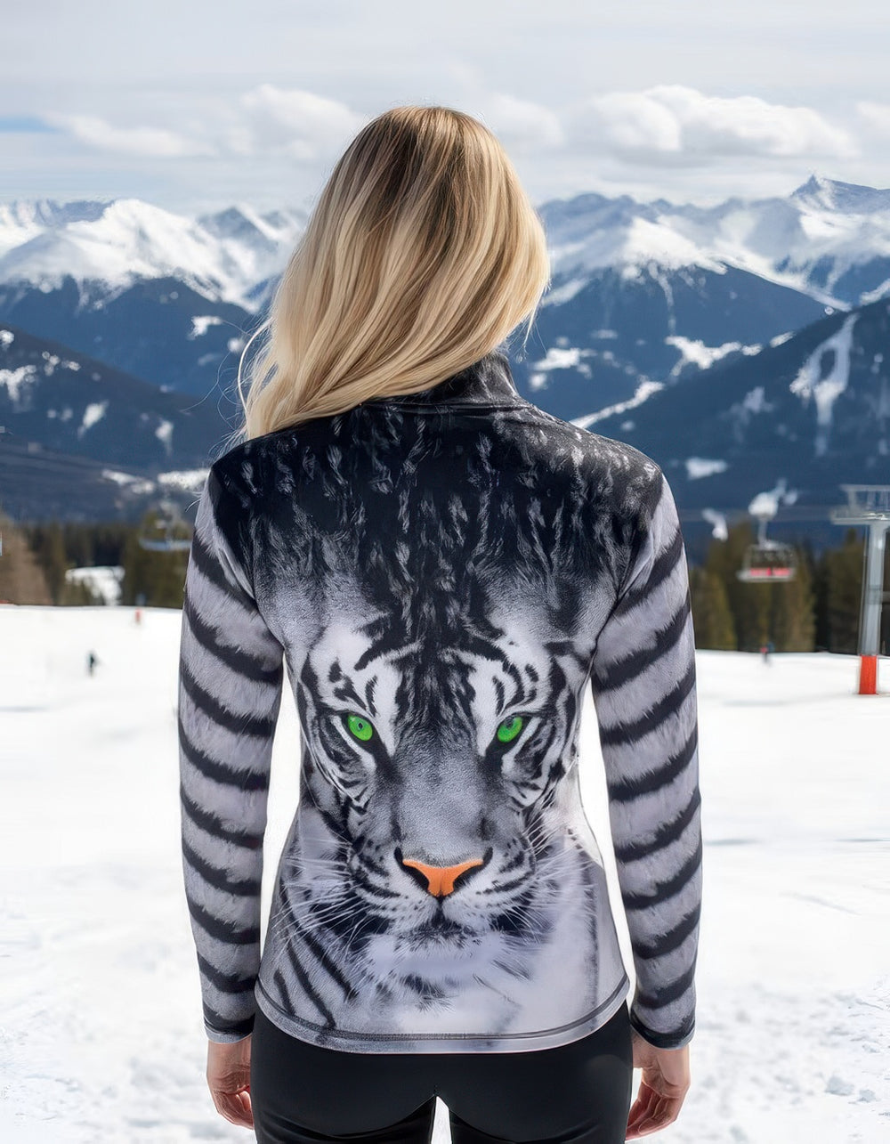 Women’s Denimaxx ski mid layer with bold Green Eyed Tiger design and flexible stretch-nylon comfort.

