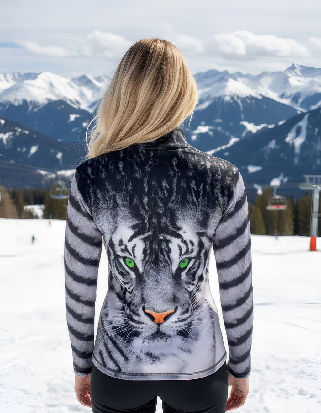Women’s Denimaxx ski mid layer with bold Green Eyed Tiger design and flexible stretch-nylon comfort.

