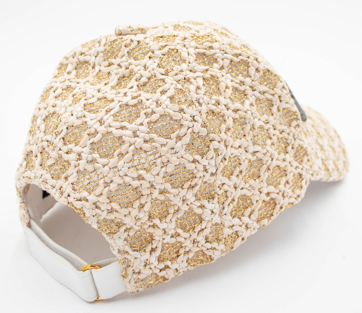 Back view of the Vail Crystal baseball cap showing the openwork weave and adjustable strap with gold buckle.