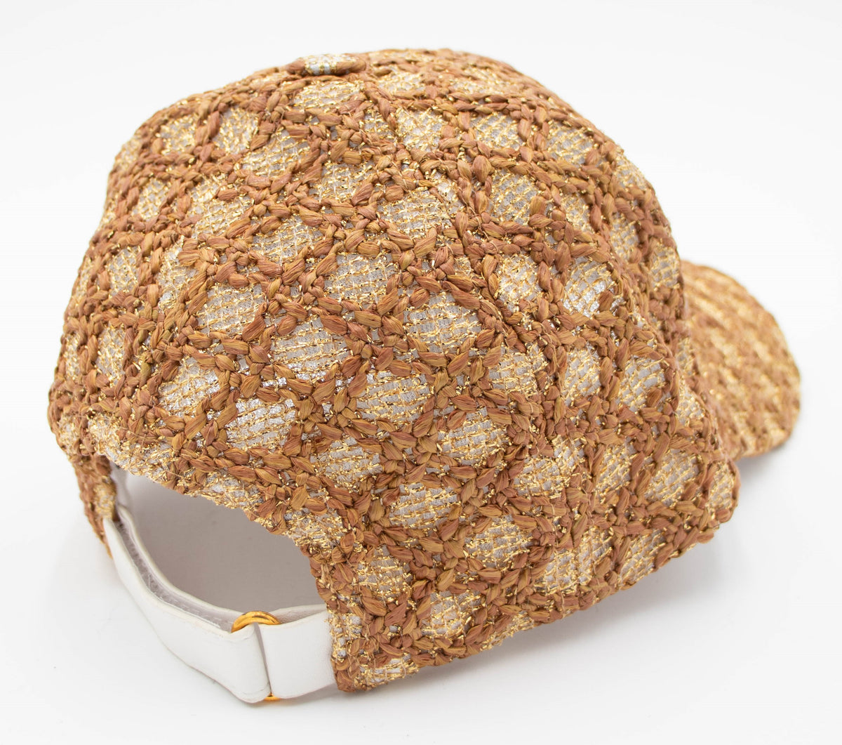 Back view of the Vail baseball cap showing the woven brown and gold texture with a white adjustable strap and gold buckle.