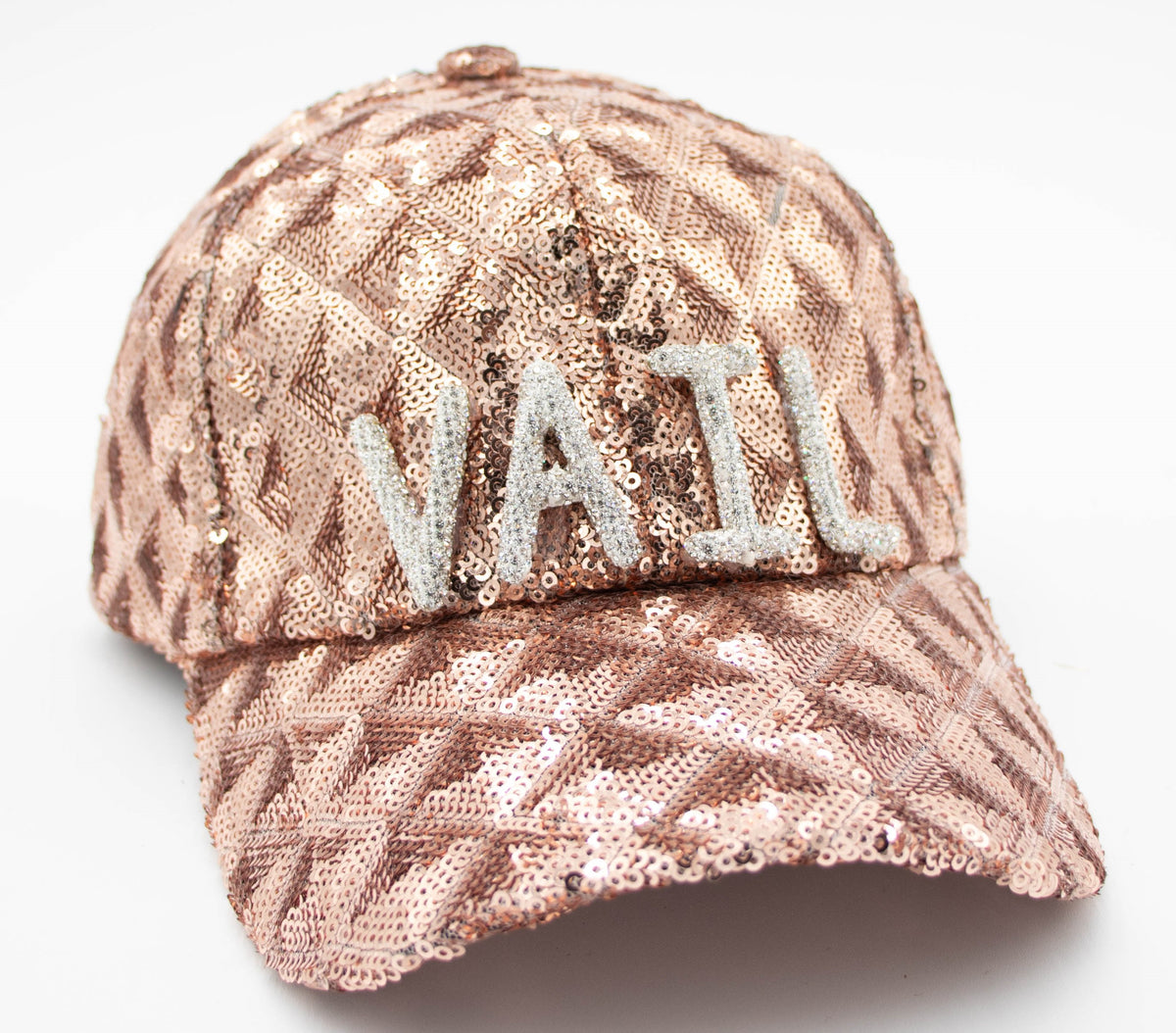 Front view of the Sequin Vail baseball cap with silver VAIL letters on shimmering rose gold sequin fabric.