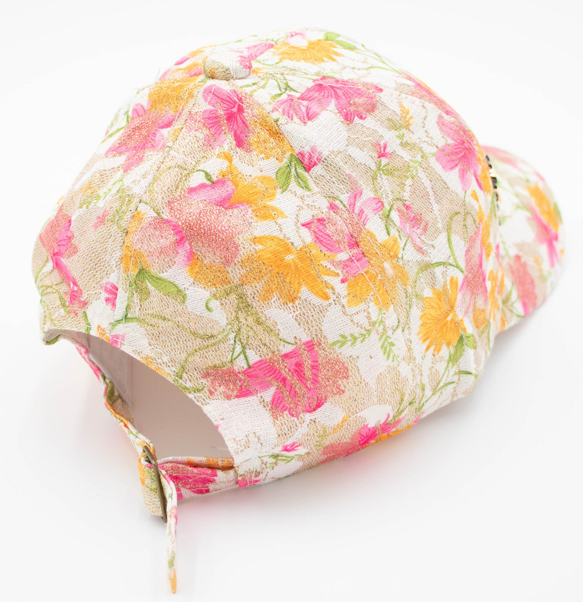 Side view of the Crystal-Embellished Vail baseball cap showing the pink floral lace crown and adjustable back strap.