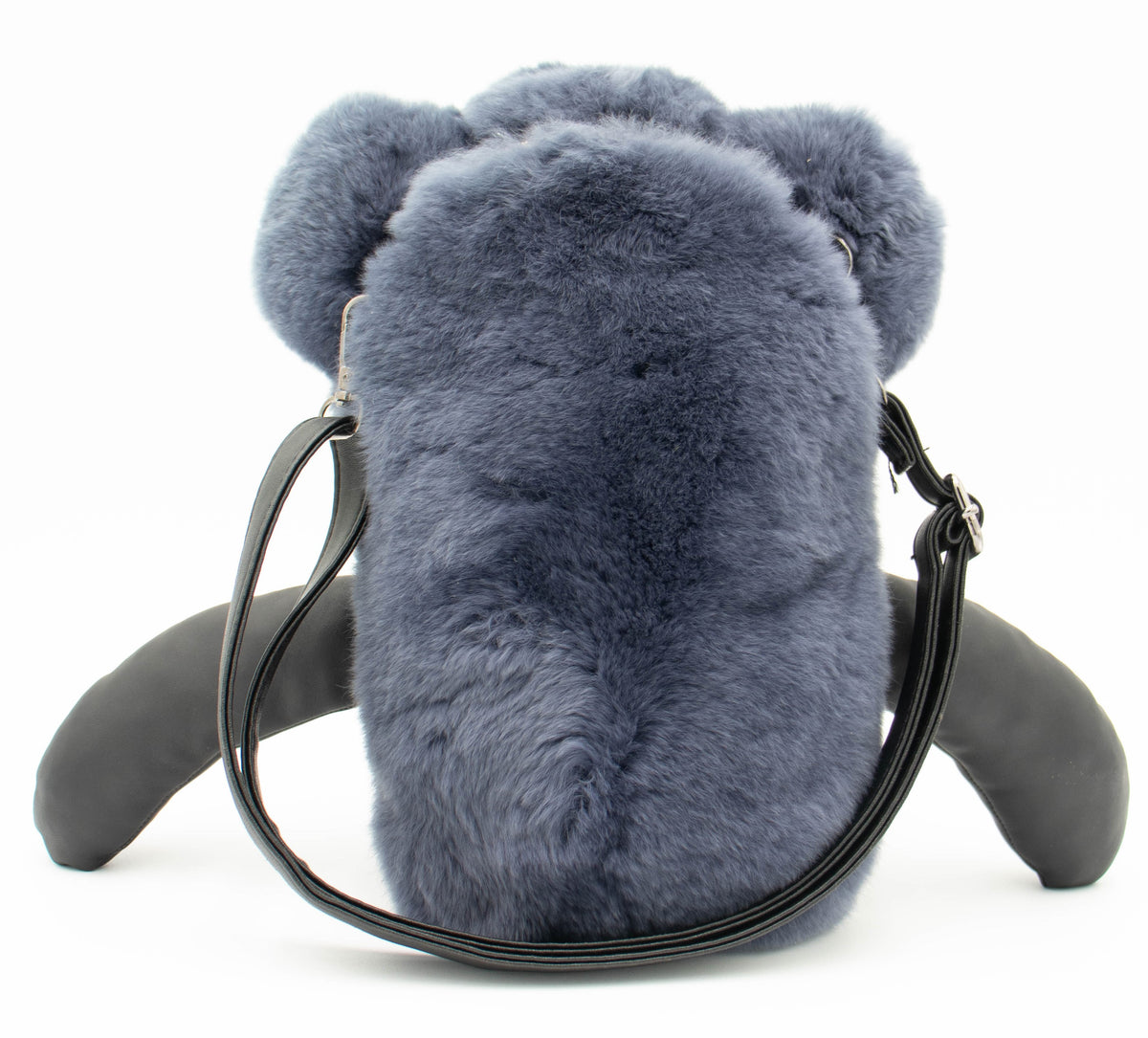 Back view of the blue rex rabbit fur bear backpack showing black adjustable shoulder straps, studio shot.