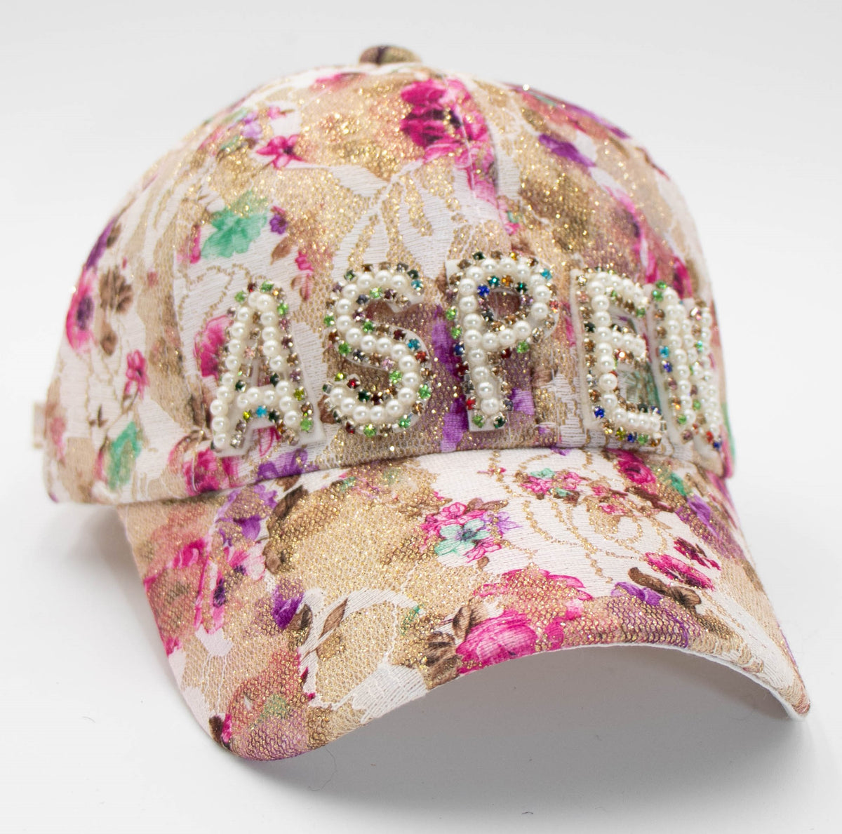 Pearl Aspen pearlescent baseball cap with gold and pink floral brocade and pearl-beaded ASPEN lettering, front view.