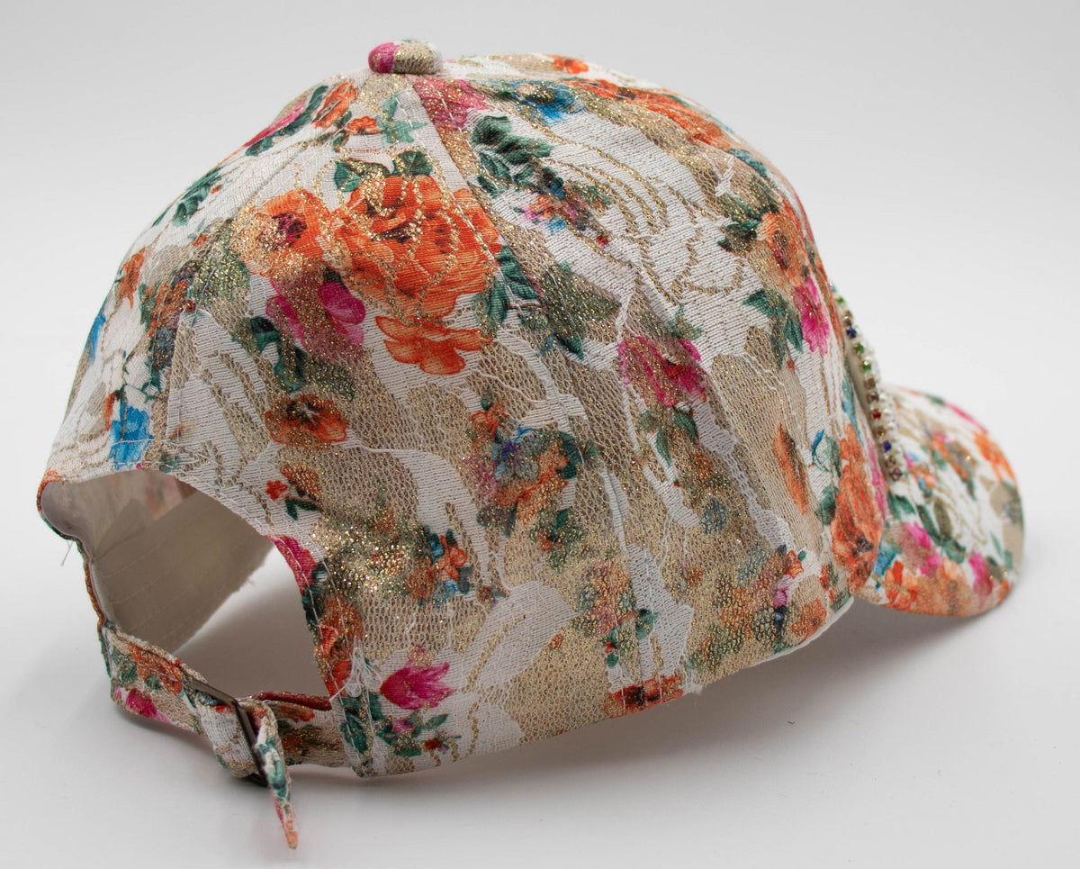 Back angle of the Pearl Aspen floral baseball cap showing the orange floral fabric and adjustable back strap.