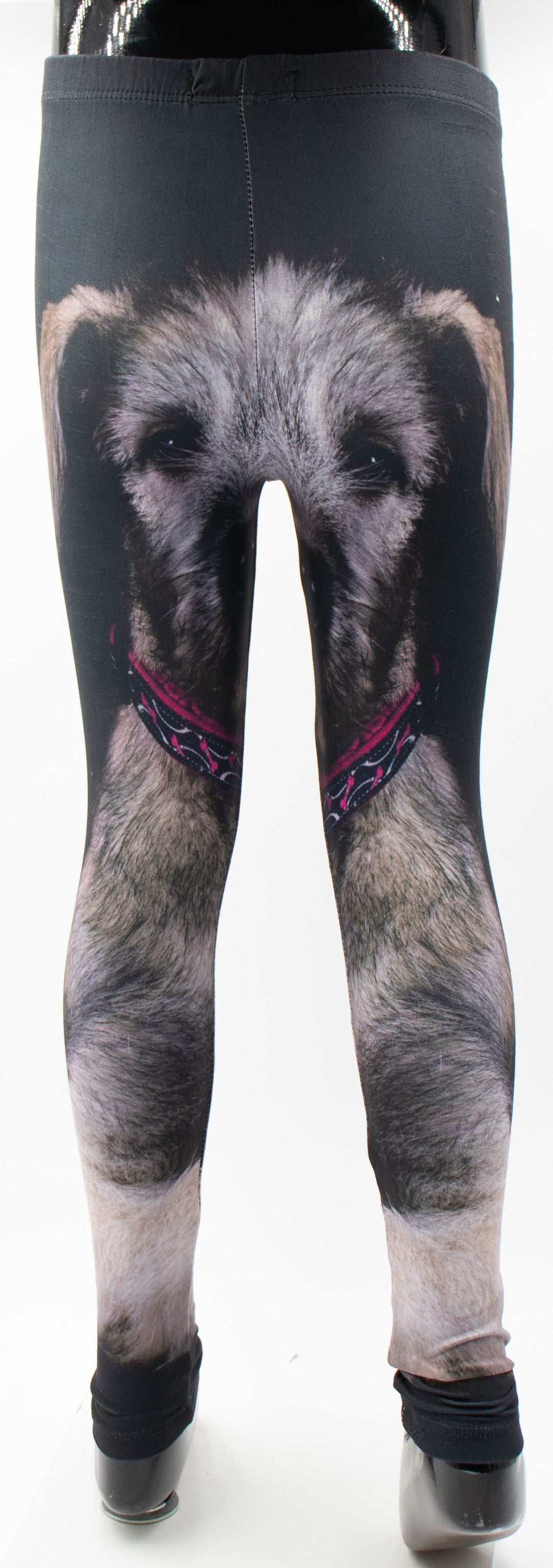 Back view of Denimaxx kids Irish Wolfhound print leggings on a mannequin, shaggy wolfhound face with pink patterned collar printed on black fabric.