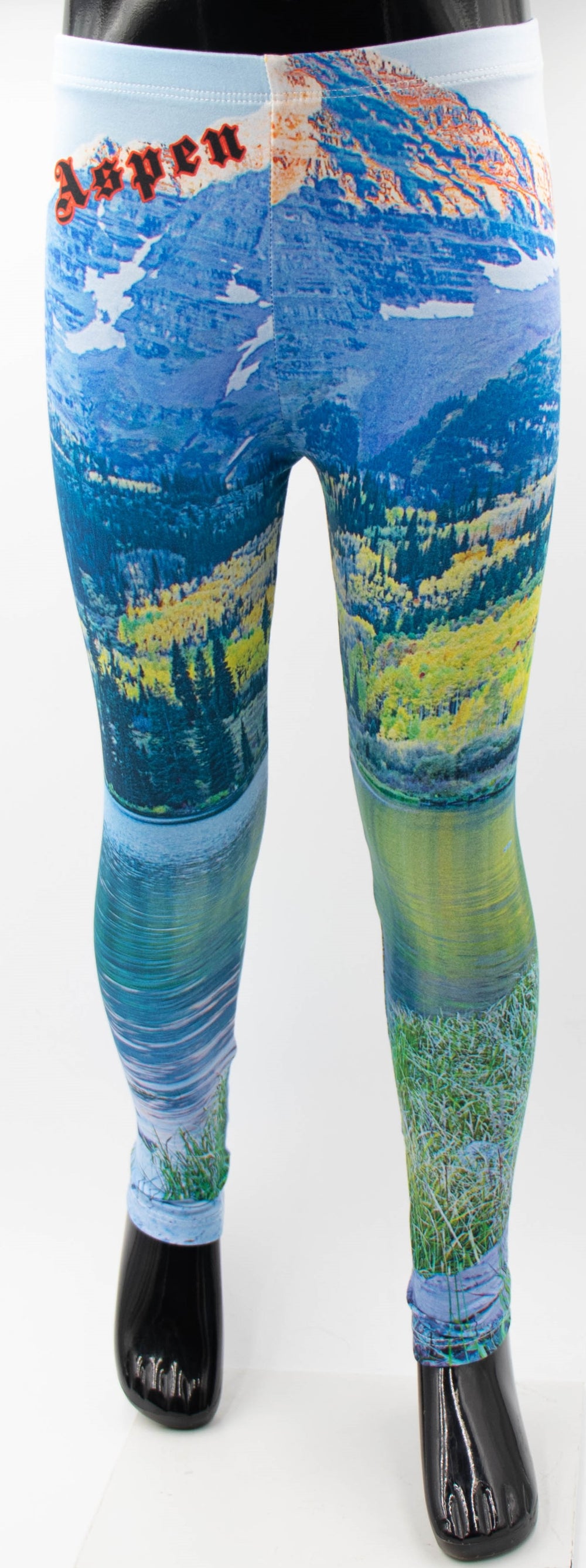 Front view of Denimaxx kids Aspen print leggings on a mannequin, showing a mountain, lake, and autumn aspen scene with Aspen script on the hip.