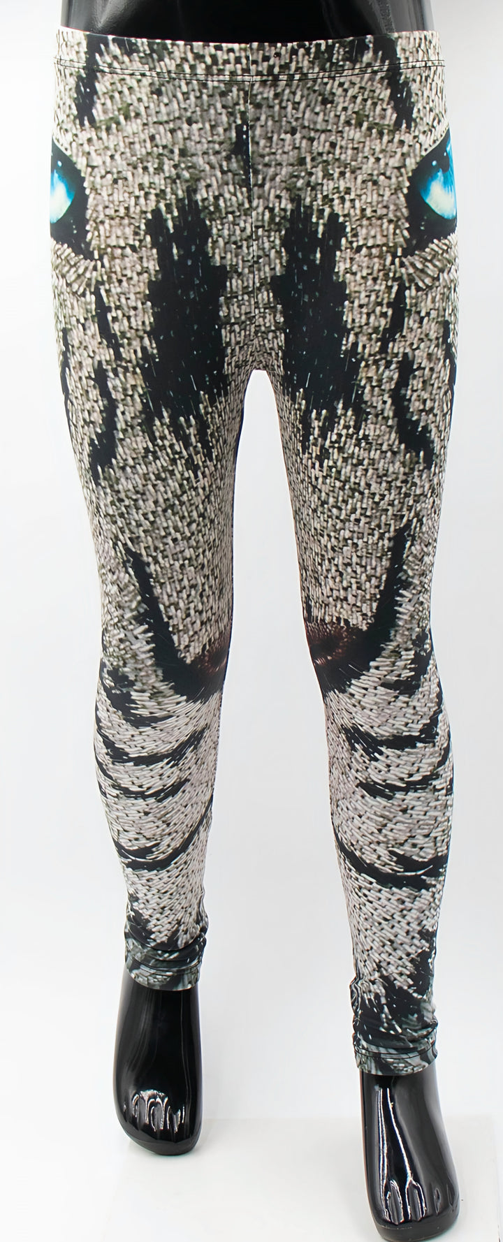 Kids roaring lion print leggings with a mosaic lion face and blue eyes, shown on a mannequin.