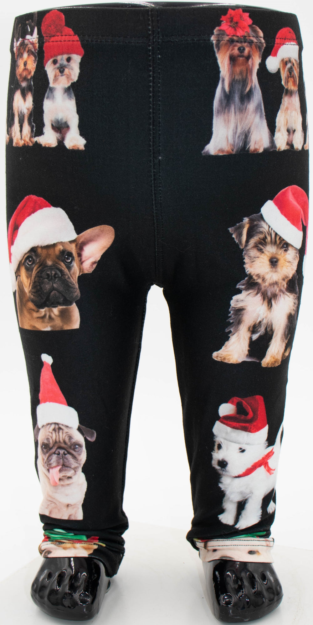 Denimaxx kids Christmas dogs print leggings with dogs in Santa hats on black fabric, shown on a mannequin.