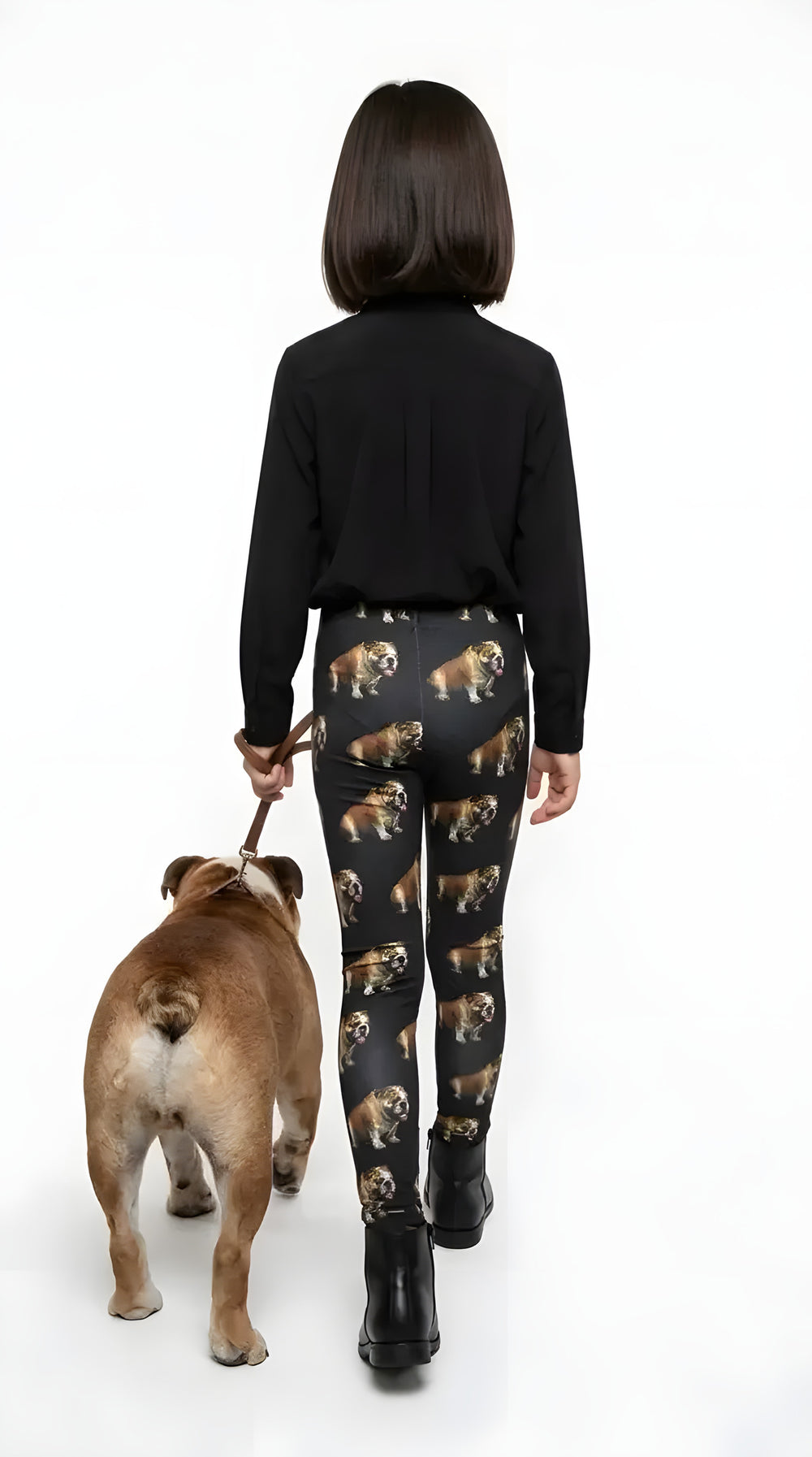 Back view of a girl walking an English bulldog, wearing black bulldog print girls leggings