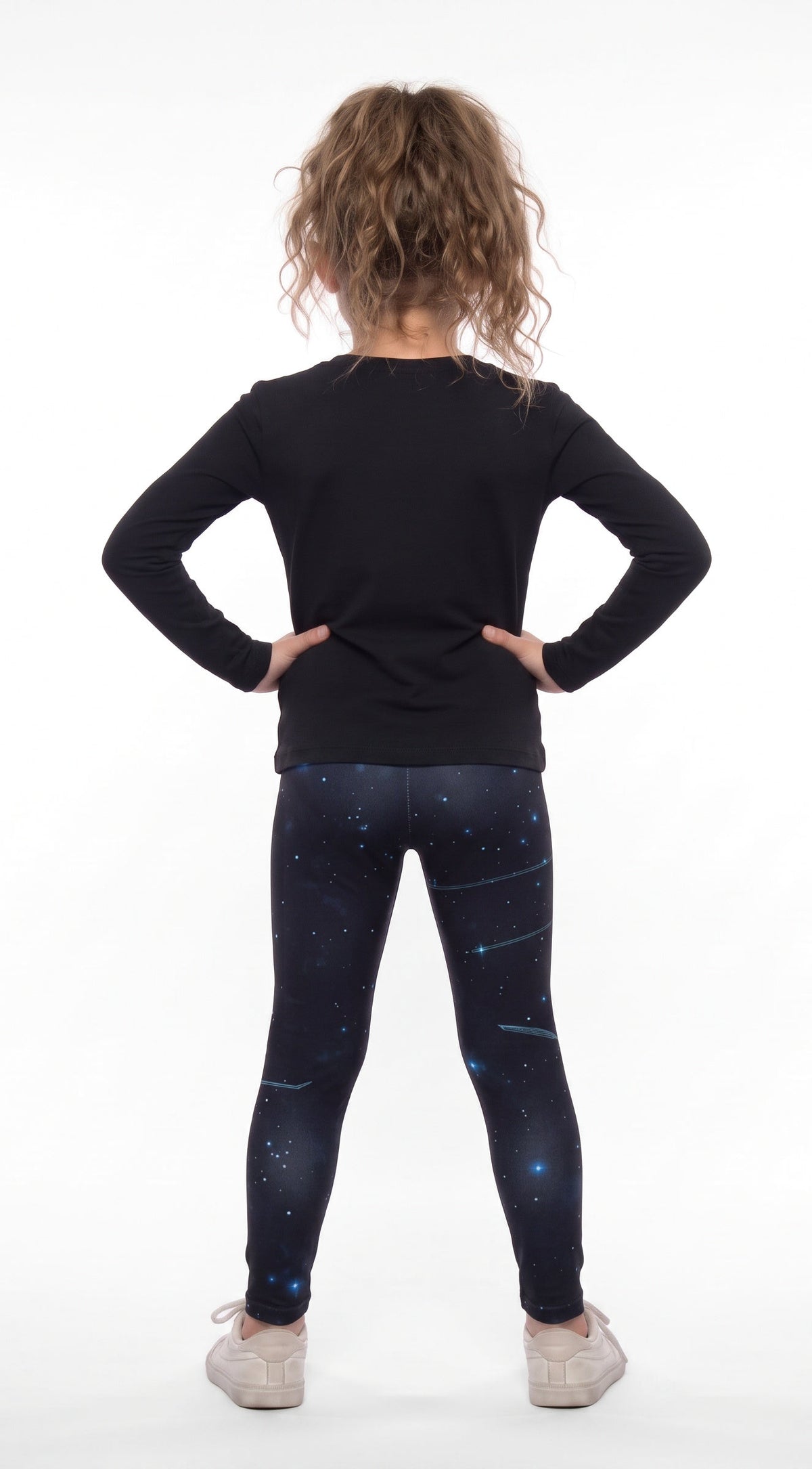 Constellations print girls leggings, navy starry night with stars and streaks, back view