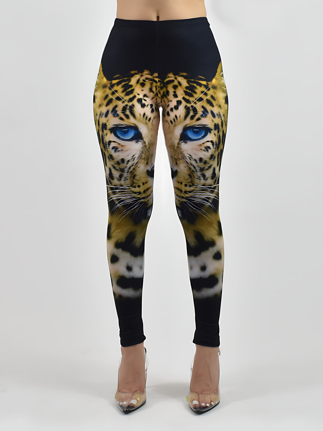 Blue-Eyed Leopard print leggings with a bold leopard face and blue eyes, shown on a model against a white studio background.