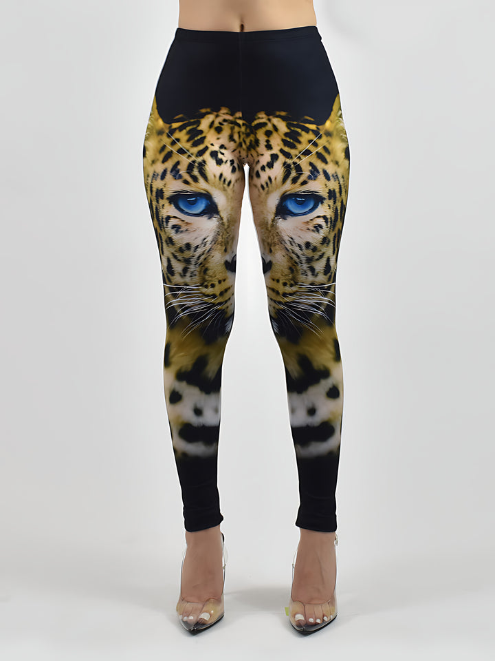 Blue-Eyed Leopard print leggings with a bold leopard face and blue eyes, shown on a model against a white studio background.