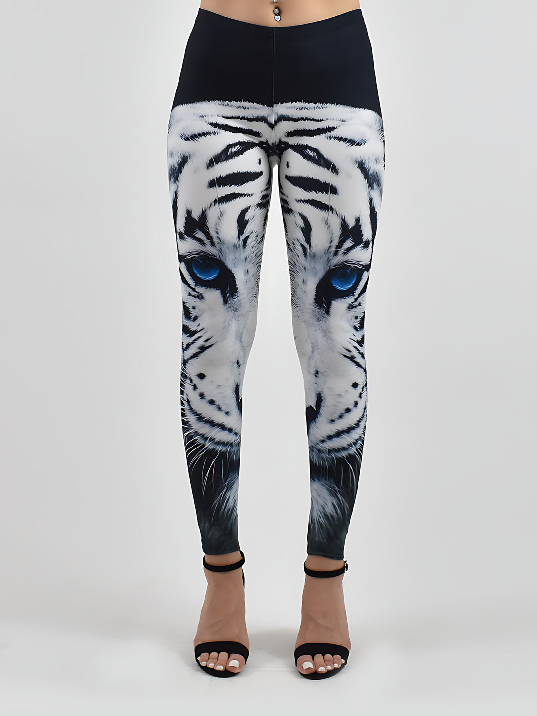 Blue-Eyed Tiger print leggings on a white background showing the full white tiger face with blue eyes down the legs.