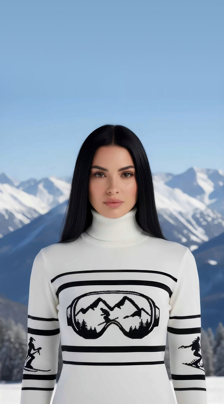 Close-up of woman wearing the white Visor Mountains turtleneck sweater with black ski goggle and mountain graphic.