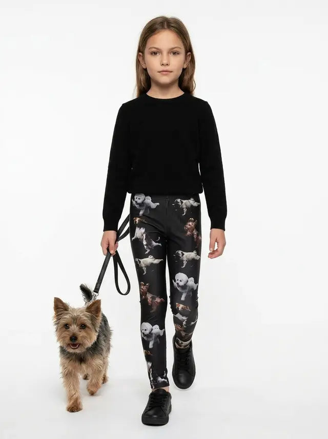 Girl wearing black yoga dogs print kids leggings with a Yorkshire Terrier