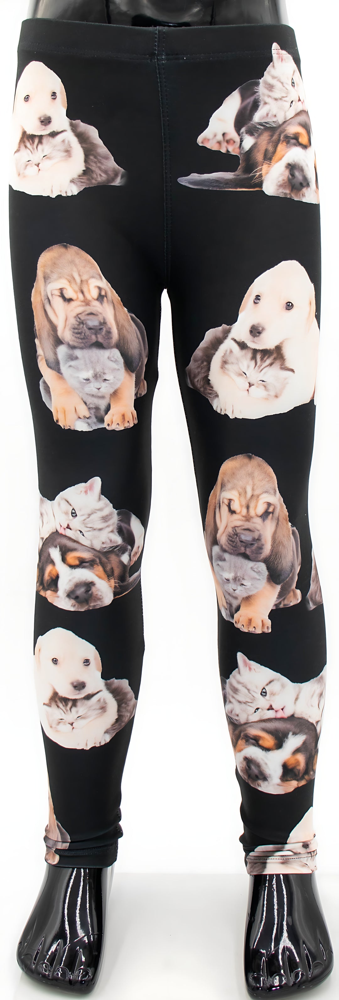Kids kitten and puppy print leggings with snuggling puppy and kitten photos on black fabric, full mannequin product shot.
