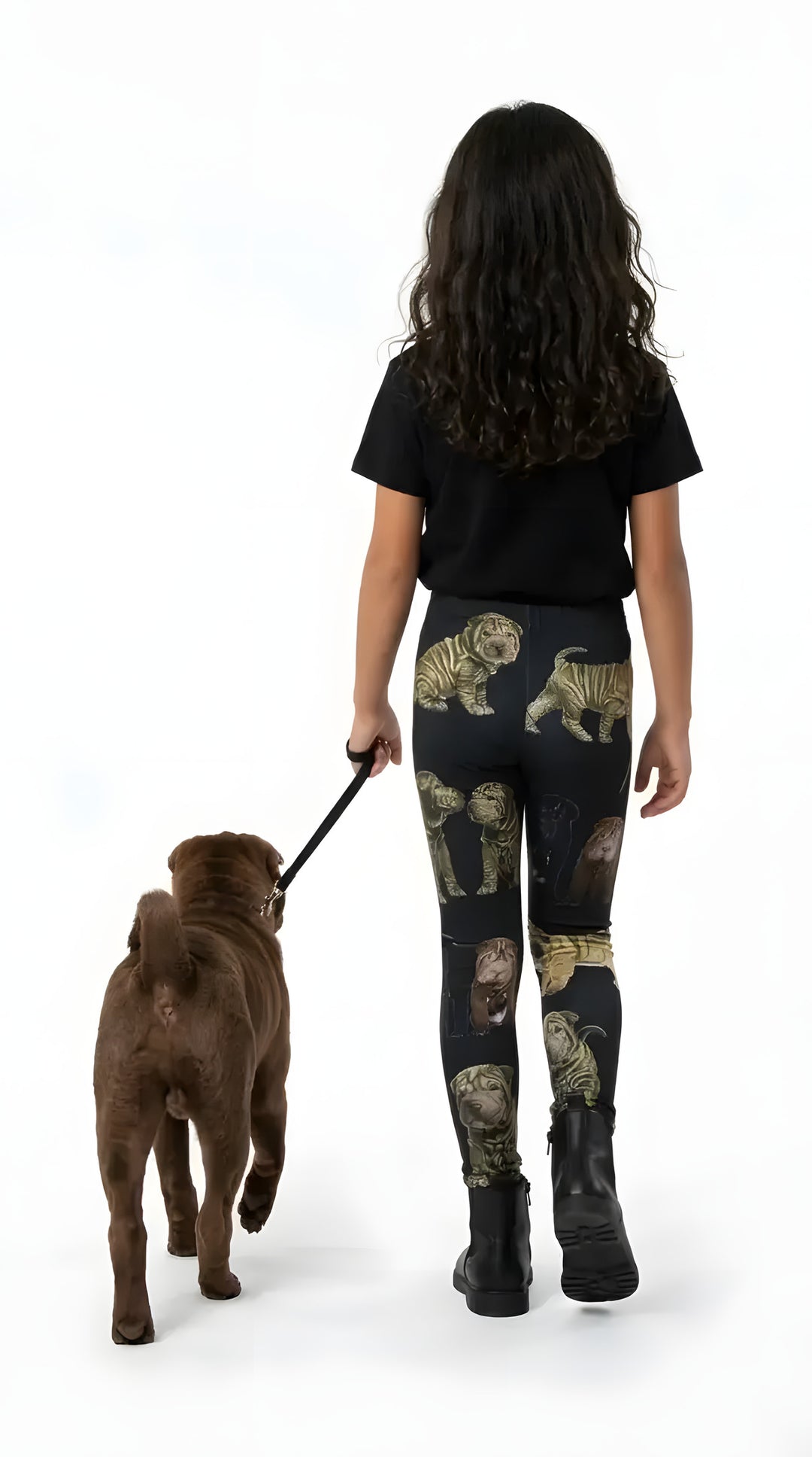 Back view of a girl walking a brown Shar Pei, wearing black Shar Pei puppy print girls leggings