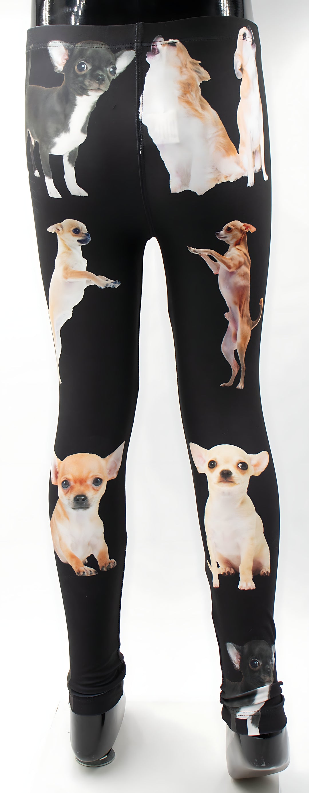 Close-up of kids Chihuahua print leggings showing the playful Chihuahua pattern on black, mannequin display.