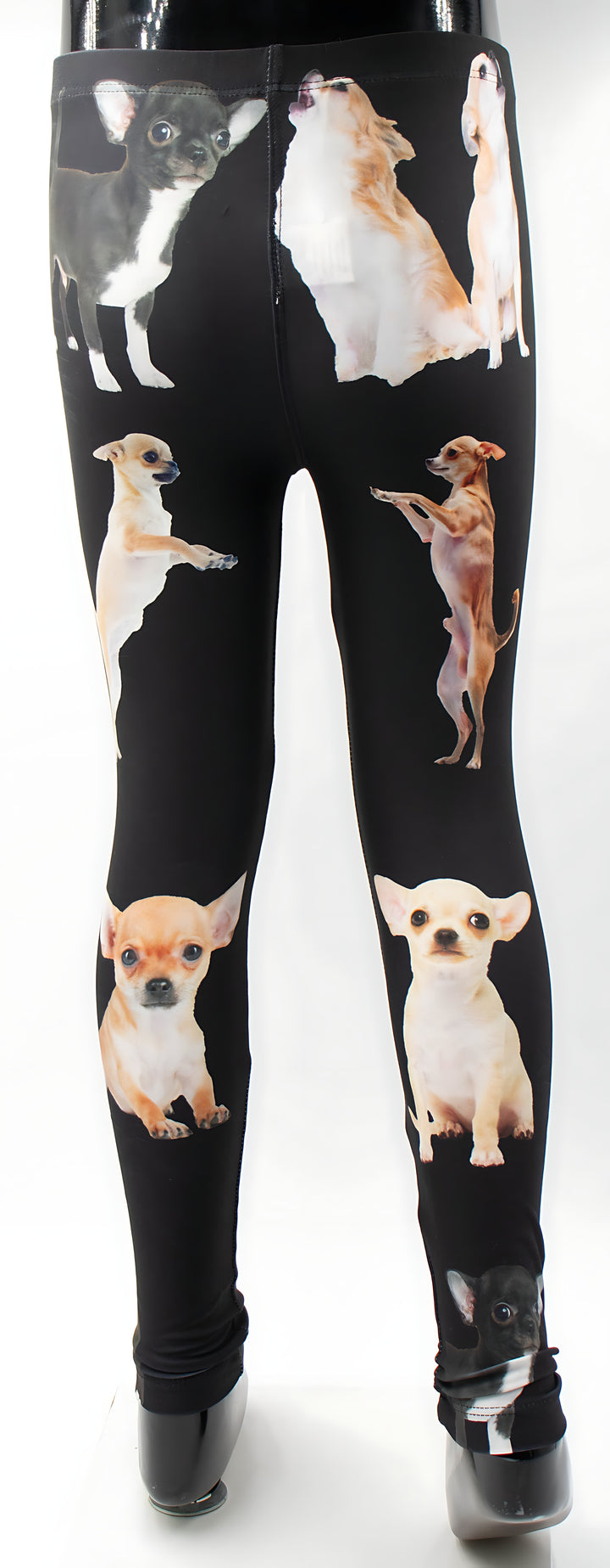 Close-up of kids Chihuahua print leggings showing the playful Chihuahua pattern on black, mannequin display.