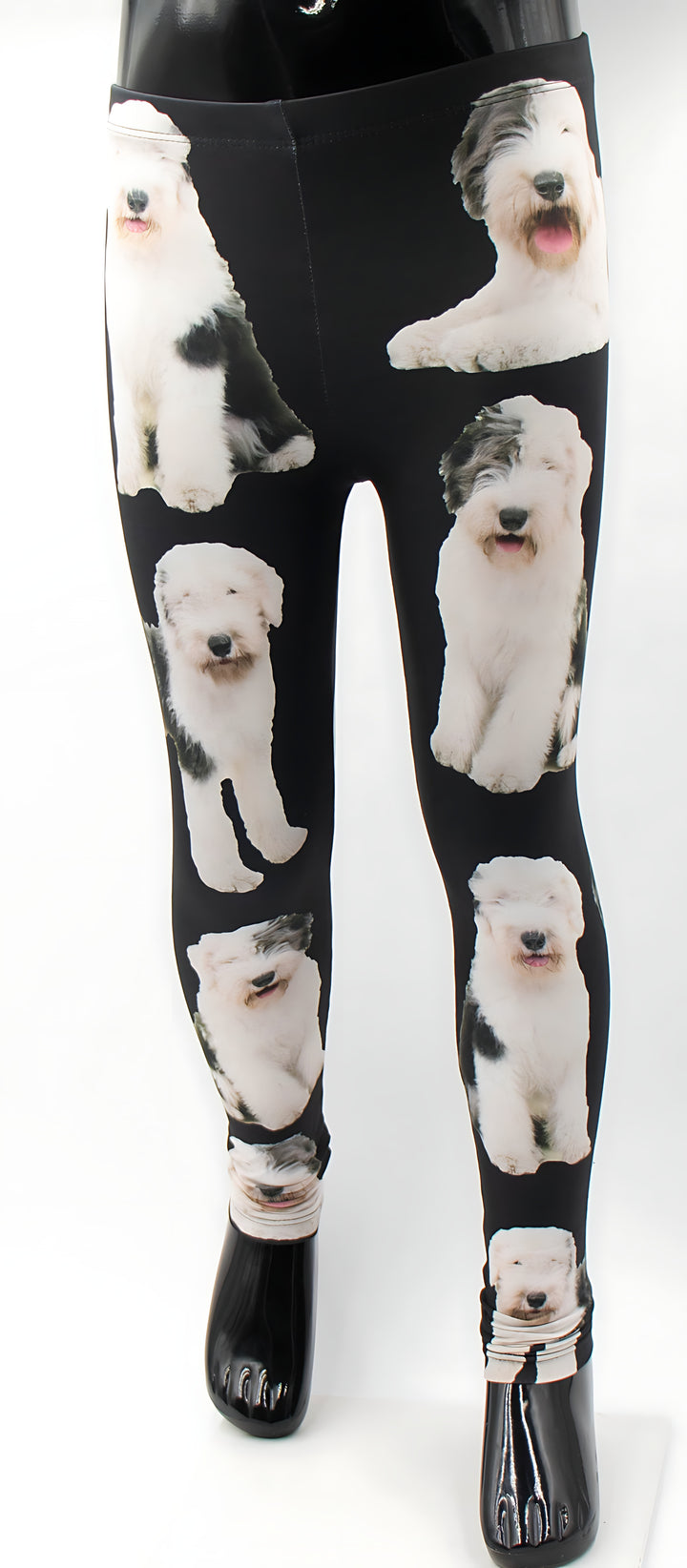 Kids English Sheepdog print leggings with fluffy white and grey sheepdog photos on black fabric, shown on a mannequin.