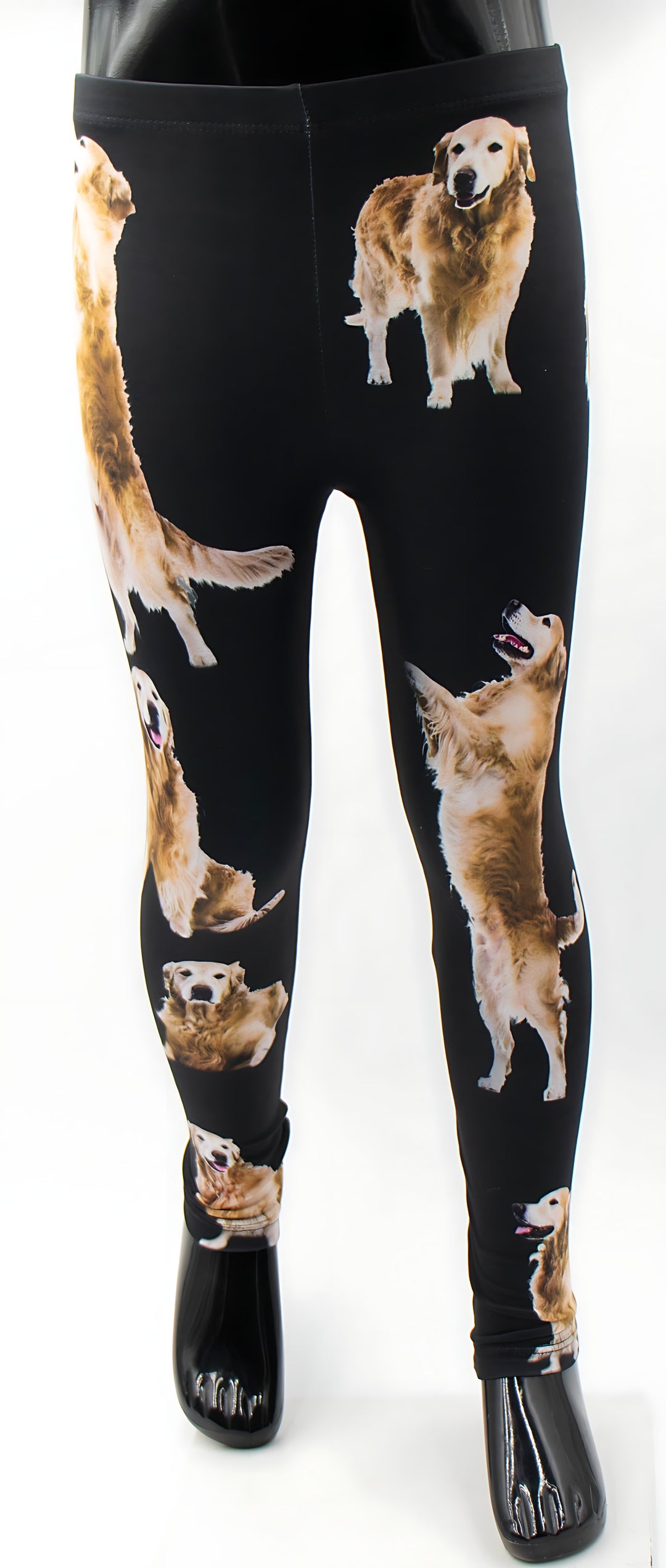 Kids Golden Retriever print leggings with golden retriever dog photos on black fabric, shown on a mannequin.