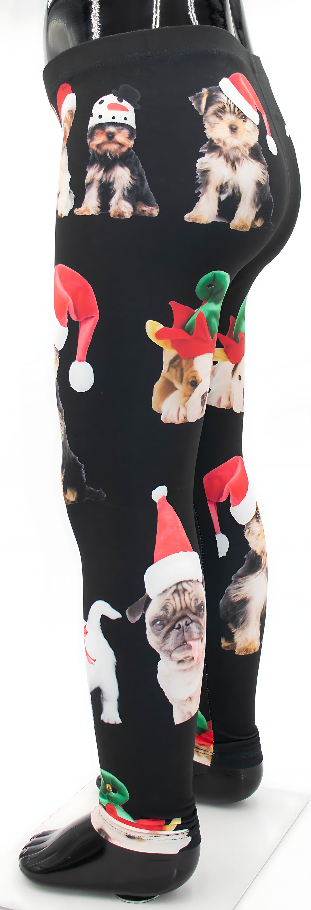 Side view of kids Christmas dogs print leggings showing the holiday dog and elf hat pattern, mannequin display.