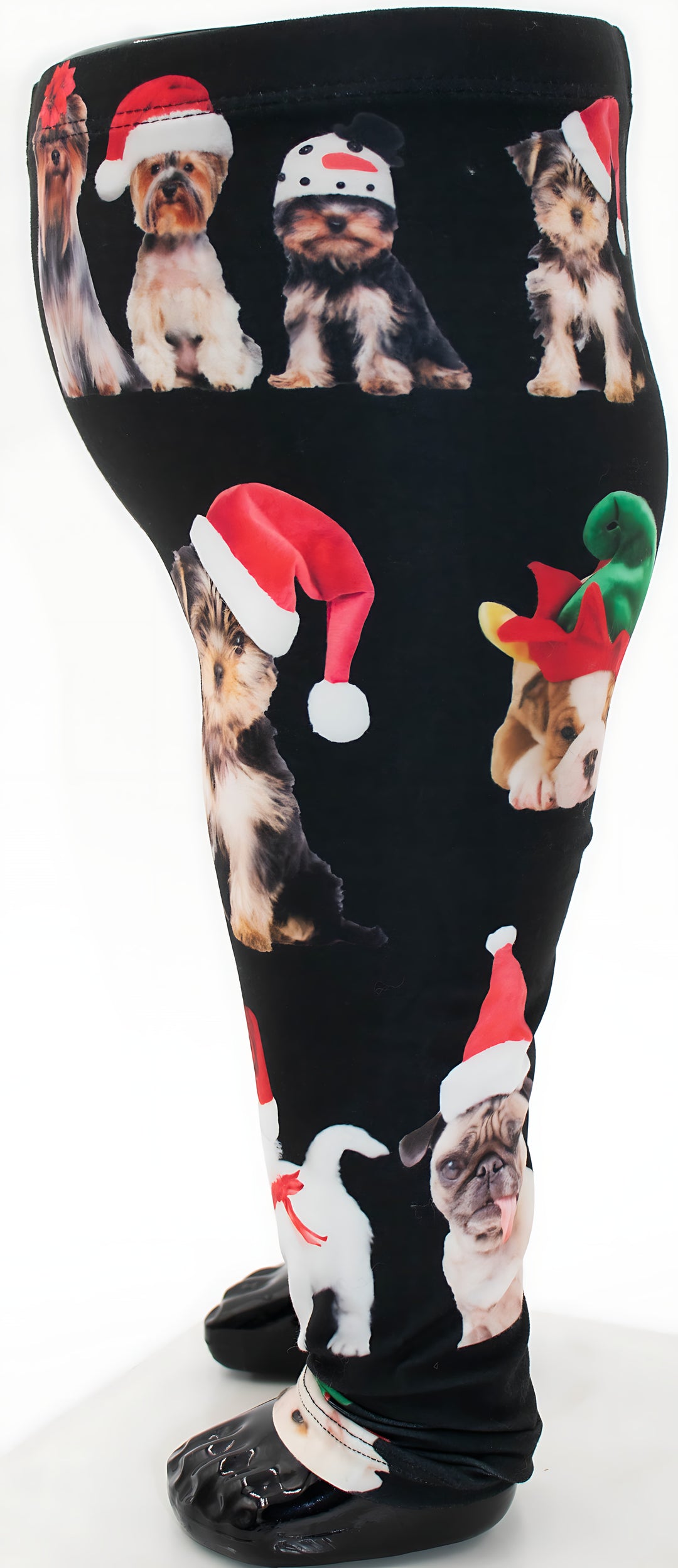 Side view of kids Christmas dogs print leggings showing Yorkies and a Pug in Santa hats, mannequin display.