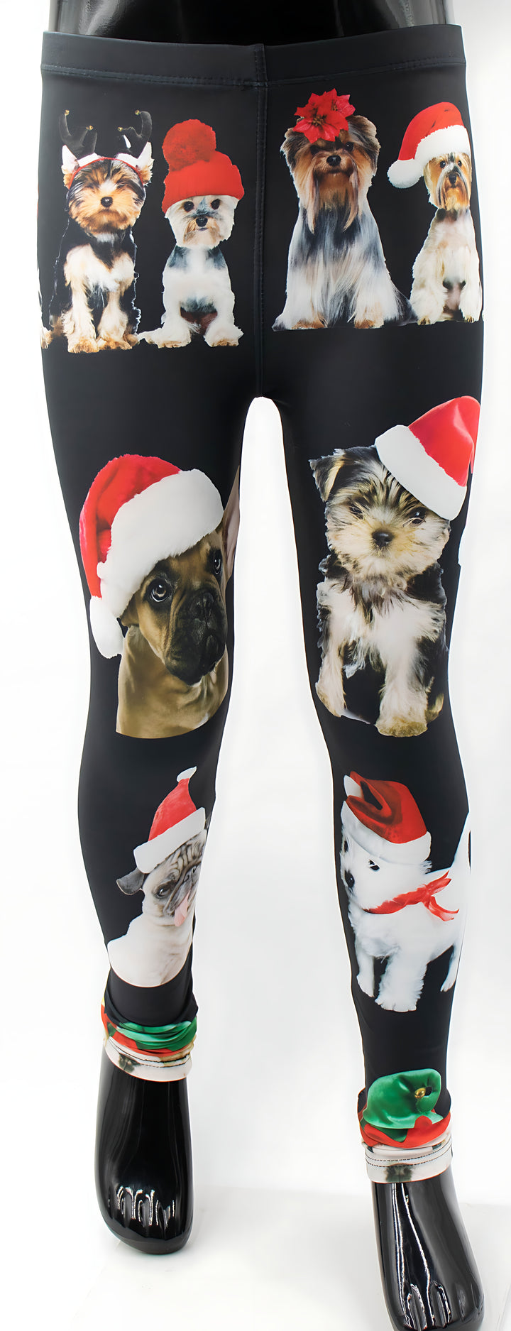 Close-up of kids Christmas dogs print leggings showing the holiday dog pattern with reindeer antlers and Santa hats.