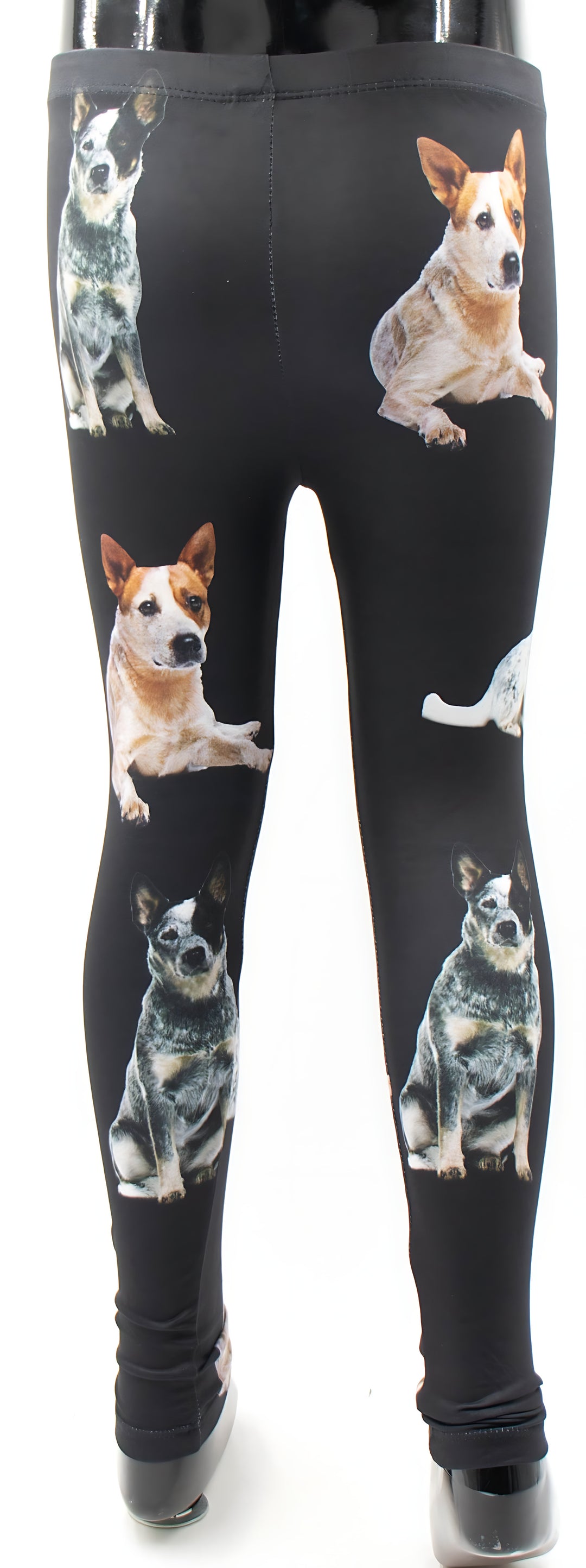Back view of kids Australian Cattle Dog print leggings with heeler dog photos on black, mannequin display.