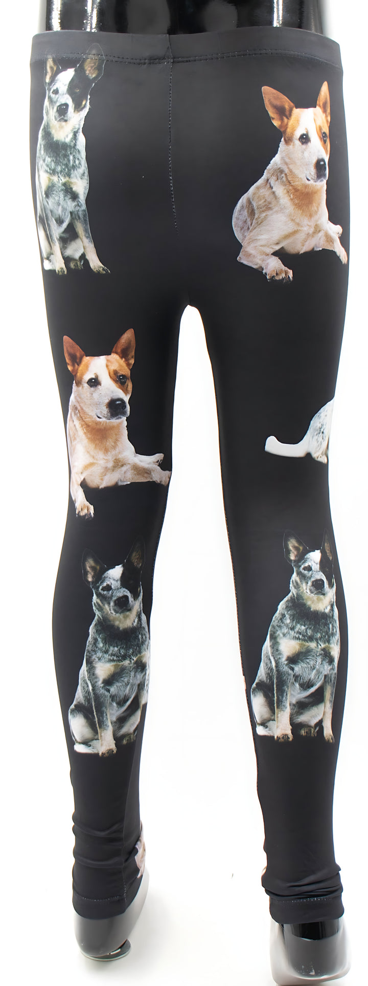 Back view of kids Australian Cattle Dog print leggings with heeler dog photos on black, mannequin display.