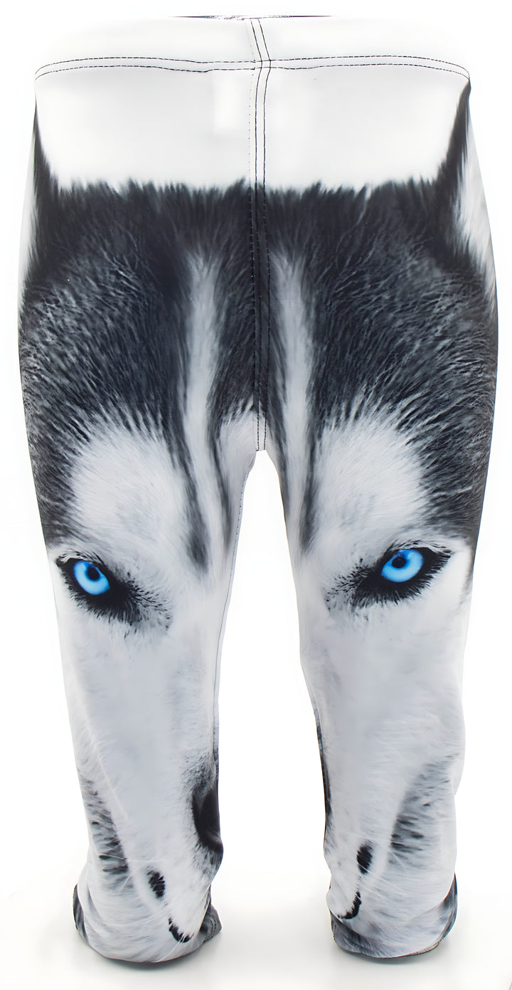 Close-up front view of kids Wolf print leggings showing the blue-eyed wolf face print and white waistband.