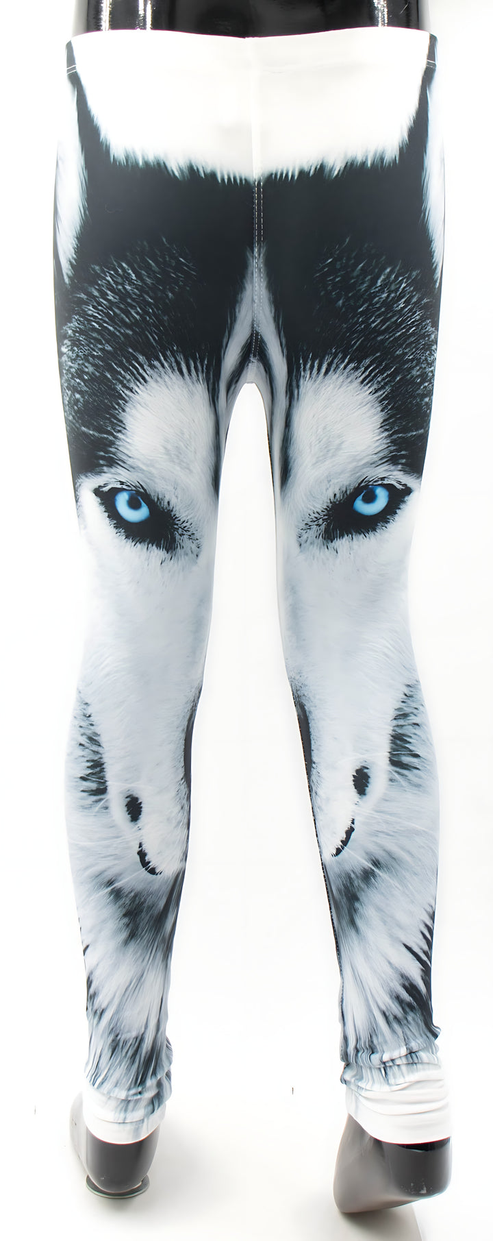 Front view of kids Wolf print leggings with the blue-eyed wolf face print and white cuffs, shown on a mannequin.