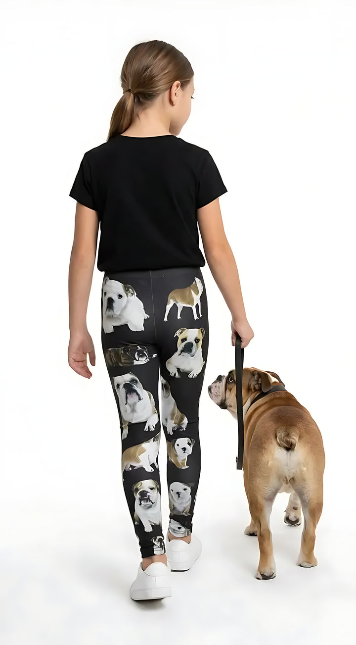 Back view of a girl in a black tee walking an English Bulldog, wearing black English Bulldog print girls leggings