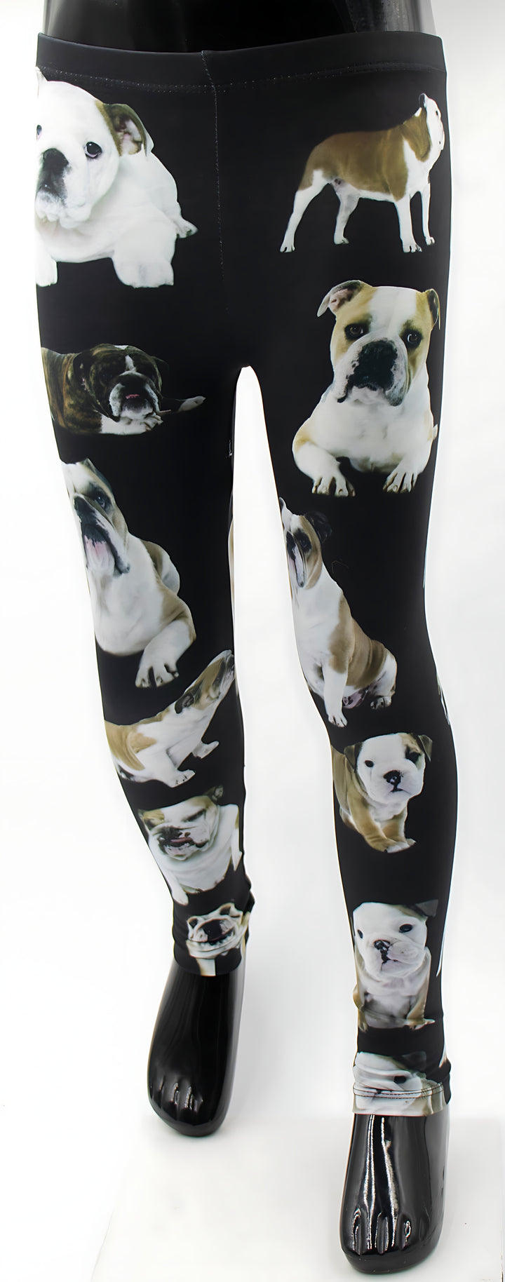 Front view of kids English Bulldog print leggings with bulldog puppy prints on black, shown on a child mannequin.